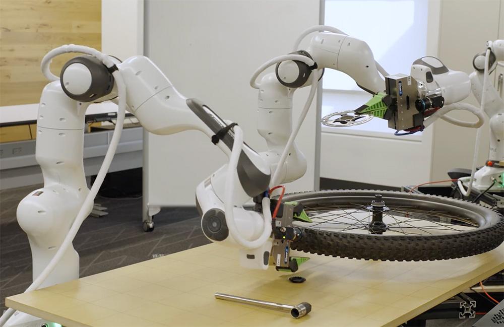 robot fixing a bike tire